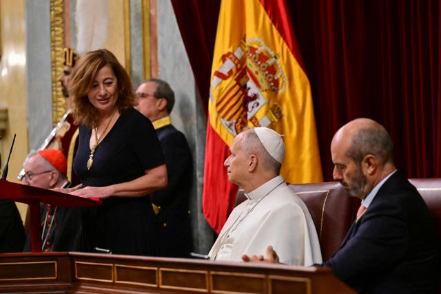 Pope Leo XIV listens to Francina Armengol, President of the Congress of Deputies (L)  during a joint session of Spain's Parliament at the Congress of Deputies in Madrid on June 8, 2026. Pope Leo XIV is visiting Spain June 6-12 with stops in Madrid, Barcelona, and the Canary Islands, where he will meet with migrants and organisations dedicated to helping them. (Photo by Stefano RELLANDINI / AFP)