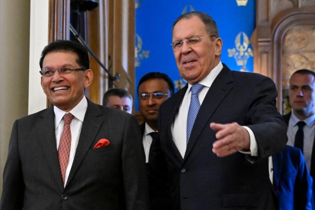 Russian Foreign Minister Sergei Lavrov and his Bangladeshi counterpart Khalilur Rahman enter a hall during a meeting in Moscow on June 8, 2026. (Photo by Alexander NEMENOV / POOL / AFP)