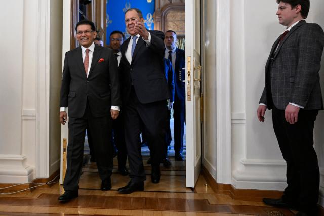Russian Foreign Minister Sergei Lavrov and his Bangladeshi counterpart Khalilur Rahman enter a hall during a meeting in Moscow on June 8, 2026. (Photo by Alexander NEMENOV / POOL / AFP)