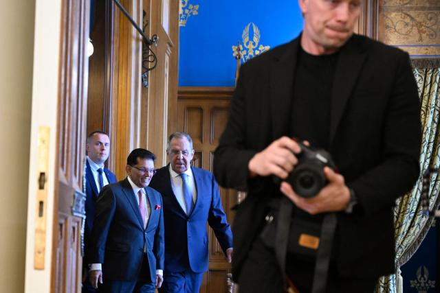 Russian Foreign Minister Sergei Lavrov and his Bangladeshi counterpart Khalilur Rahman enter a hall during a meeting in Moscow on June 8, 2026. (Photo by Alexander NEMENOV / POOL / AFP)