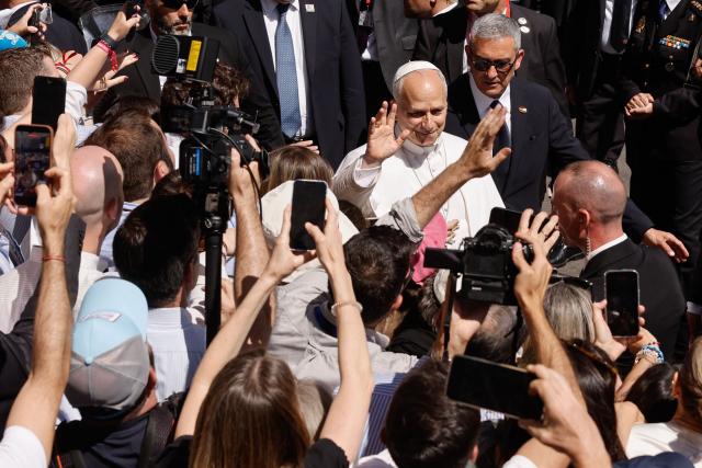 Pope Leo XIV greets people as he leaves the Congress of Deputies after delivering a speech to a joint session of the Spanish Parliament in Madrid on June 8, 2026. Pope Leo XIV is visiting Spain June 6-12 with stops in Madrid, Barcelona, and the Canary Islands, where he will meet with migrants and organisations dedicated to helping them. (Photo by Oscar DEL POZO / AFP)