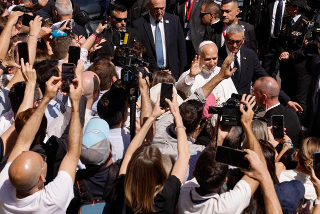 Pope Leo XIV greets people as he leaves the Congress of Deputies after delivering a speech to a joint session of the Spanish Parliament in Madrid on June 8, 2026. Pope Leo XIV is visiting Spain June 6-12 with stops in Madrid, Barcelona, and the Canary Islands, where he will meet with migrants and organisations dedicated to helping them. (Photo by Oscar DEL POZO / AFP)