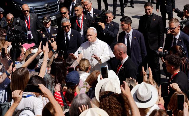 Pope Leo XIV greets people as he leaves the Congress of Deputies after delivering a speech to a joint session of the Spanish Parliament in Madrid on June 8, 2026. Pope Leo XIV is visiting Spain June 6-12 with stops in Madrid, Barcelona, and the Canary Islands, where he will meet with migrants and organisations dedicated to helping them. (Photo by Oscar DEL POZO / AFP)