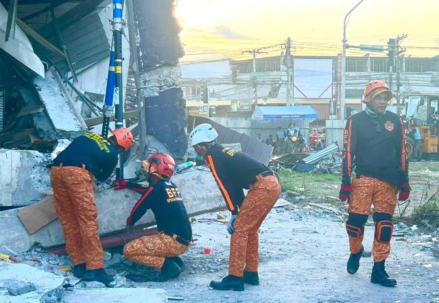 Responders conduct a rescue operation at a collapsed building after a 7.8 magnitude earthquake in General Santos City on June 8, 2026. A 7.8-magnitude earthquake struck the southern Philippines on June 8, killing at least 15 people, collapsing buildings and sparking tsunami warnings across the region. (Photo by Ferdinandh Cabrera / AFP)
