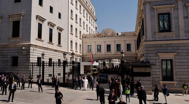 Pope Leo XIV waves before to greet people as he leaves the Congress of Deputies after delivering a speech to a joint session of the Spanish Parliament in Madrid on June 8, 2026. Pope Leo XIV is visiting Spain June 6-12 with stops in Madrid, Barcelona, and the Canary Islands, where he will meet with migrants and organisations dedicated to helping them. (Photo by Oscar DEL POZO / AFP)