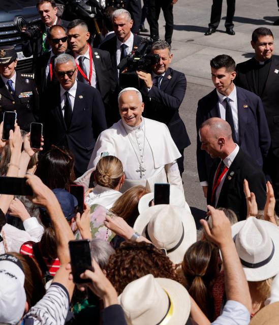 Pope Leo XIV greets people as he leaves the Congress of Deputies after delivering a speech to a joint session of the Spanish Parliament in Madrid on June 8, 2026. Pope Leo XIV is visiting Spain June 6-12 with stops in Madrid, Barcelona, and the Canary Islands, where he will meet with migrants and organisations dedicated to helping them. (Photo by Oscar DEL POZO / AFP)