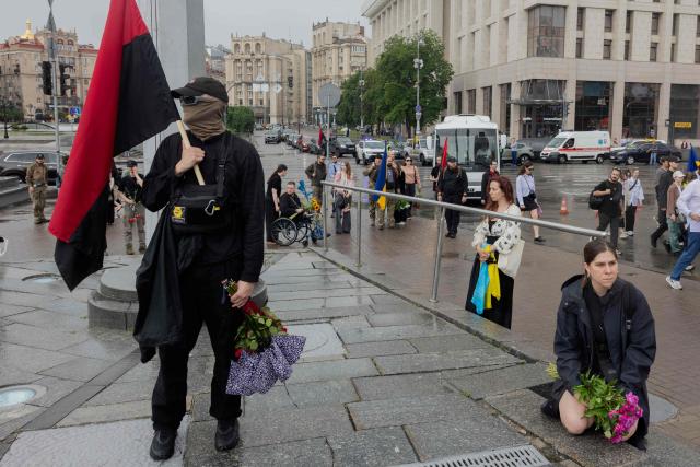 Mourners attend the funeral ceremony of Yaroslav Varnak, 23 years old a serviceman who was killed in action in Kyiv on June 8, 2026, amid the Russian invasion of Ukraine. (Photo by Tetiana DZHAFAROVA / AFP)