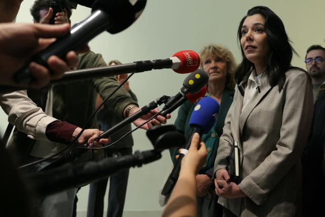 (FILES) La France Insoumise (LFI) left wing MP Sophia Chikirou (2ndR) speaks to the press as she arrives for her trial on fraud charges at the Paris courthouse on May 12, 2026. La France Insoumise (LFI) left-wing MP Sophia Chikirou was acquitted on June 8, 2026, by the Paris criminal court of fraud charges related to a media outlet she had co-founded, but convicted of theft in the same case, which resurfaced during her campaign for the municipal elections in the capital. (Photo by Thomas SAMSON / AFP)