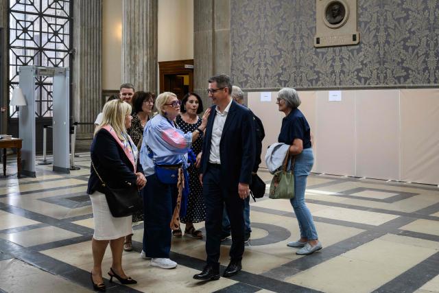 Former mayor of Saint-Etienne Gael Perdriau discusses with supporters as he waits during his appeal trial in the sex-tape blackmail case at the Lyon Court of Appeal on June 8, 2026. The former mayor of Saint-Etienne, Gaël Perdriau, is retried on appeal starting June 8, 2026, six months after being found "fully guilty" and sentenced to a prison term for blackmail involving a sex-tape of his first deputy. (Photo by JEFF PACHOUD / AFP)