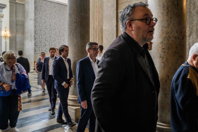 Former mayor of Saint Etienne Gael Perdriau (C) and Defendant Gilles Rossary-Lenglet enter courthouse during Gael Perdriau's appeal trial in the sex-tape blackmail case at the Lyon Court of Appeal on June 8, 2026. The former mayor of Saint-Etienne, Gaël Perdriau, is retried on appeal starting June 8, 2026, six months after being found "fully guilty" and sentenced to a prison term for blackmail involving a sex-tape of his first deputy. (Photo by JEFF PACHOUD / AFP)