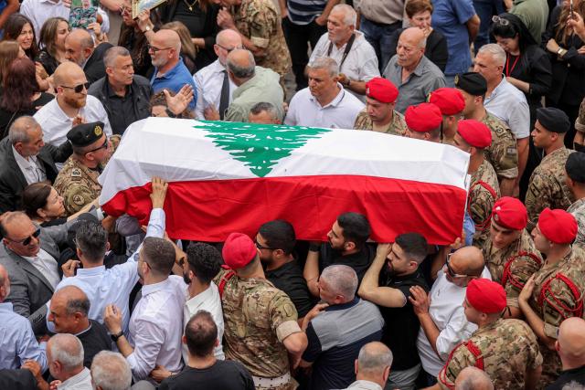 Mourners carry the coffin of Lebanese army captain Elie Khoury, who was killed by Israeli bombardment, during his funeral in his home village of Kfar Jarra near Jezzine in southern Lebanon on June 8, 2026. An Israeli strike in southern Lebanon killed three soldiers, Beirut's military said on June 6, as its chief travelled to Pakistan to meet with a key mediator in efforts to end the Middle East war. Israel has launched an operation in Lebanon to root out the Tehran-backed armed group Hezbollah, which drew Lebanon into the wider Middle East war by launching missiles on behalf of its sponsor. (Photo by MAHMOUD ZAYYAT / AFP)