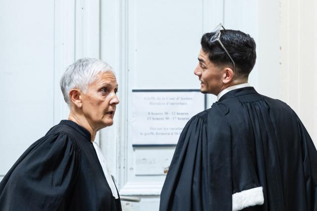 Fabienne Roy-Nansion (L), lawyer for the civil party speaks to Sullyman Bouderba, lawyer of Jerome P. charged with rape and violence in a context of coercive control and polygamy before his trial at the Saint-Omer Judicial Court, in Saint-Omer, northern France, on June 8, 2026. The trial of a man accused of ruling his home with terror for two decades, where he lived with three women and their children, opened on June 8, 2026, in the Pas-de-Calais. The defendant denies any violence but acknowledges a “bizarre” family dynamic. (Photo by Sameer Al-DOUMY / AFP)