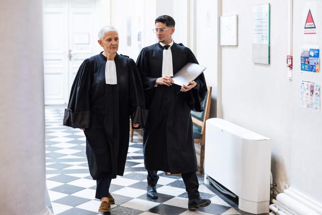Fabienne Roy-Nansion (L), lawyer for the civil party speaks to Sullyman Bouderba, lawyer of Jerome P. charged with rape and violence in a context of coercive control and polygamy before his trial at the Saint-Omer Judicial Court, in Saint-Omer, northern France, on June 8, 2026. The trial of a man accused of ruling his home with terror for two decades, where he lived with three women and their children, opened on June 8, 2026, in the Pas-de-Calais. The defendant denies any violence but acknowledges a “bizarre” family dynamic. (Photo by Sameer Al-DOUMY / AFP)