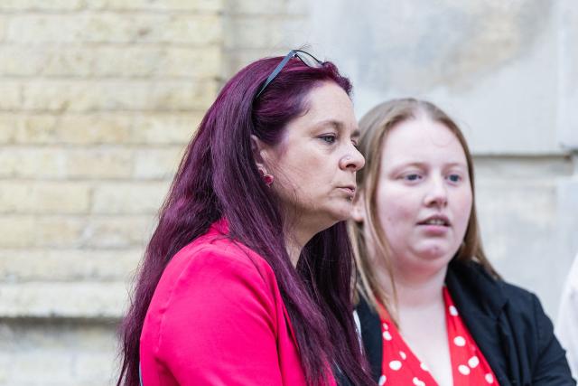 Complainant Jennifer C. (L), waits outside the Judicial Court before the trial of Jerome P. charged with rape and violence in a context of coercive control and polygamy at the Saint-Omer Judicial Court, in Saint-Omer, northern France, on June 8, 2026. The trial of a man accused of ruling his home with terror for two decades, where he lived with three women and their children, opened on June 8, 2026, in the Pas-de-Calais. The defendant denies any violence but acknowledges a “bizarre” family dynamic. (Photo by Sameer Al-DOUMY / AFP)