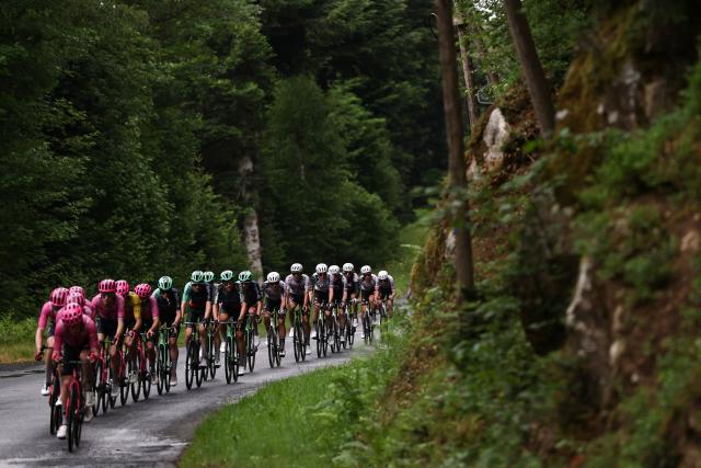EF Education - EasyPost's team riders lead the pack of riders (peloton) during the 2nd stage of the Tour Auvergne-Rhone-Alpes cycling race (formerly known as the Criterium du Dauphine), 234,3km between Saint-Martin-Le-Vinoux in the French Alps and Le Puy-en-Velay near the Massif Central, on June 8, 2026. (Photo by Anne-Christine POUJOULAT / AFP)