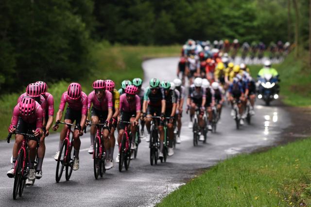 EF Education - EasyPost's team riders lead the pack of riders (peloton) during the 2nd stage of the Tour Auvergne-Rhone-Alpes cycling race (formerly known as the Criterium du Dauphine), 234,3km between Saint-Martin-Le-Vinoux in the French Alps and Le Puy-en-Velay near the Massif Central, on June 8, 2026. (Photo by Anne-Christine POUJOULAT / AFP)