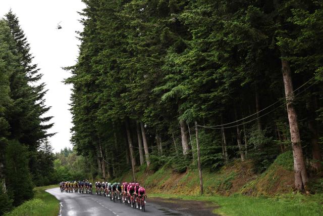 EF Education - EasyPost's team riders lead the pack of riders (peloton) during the 2nd stage of the Tour Auvergne-Rhone-Alpes cycling race (formerly known as the Criterium du Dauphine), 234,3km between Saint-Martin-Le-Vinoux in the French Alps and Le Puy-en-Velay near the Massif Central, on June 8, 2026. (Photo by Anne-Christine POUJOULAT / AFP)