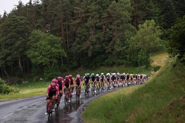 EF Education - EasyPost's team riders lead the pack of riders (peloton) during the 2nd stage of the Tour Auvergne-Rhone-Alpes cycling race (formerly known as the Criterium du Dauphine), 234,3km between Saint-Martin-Le-Vinoux in the French Alps and Le Puy-en-Velay near the Massif Central, on June 8, 2026. (Photo by Anne-Christine POUJOULAT / AFP)
