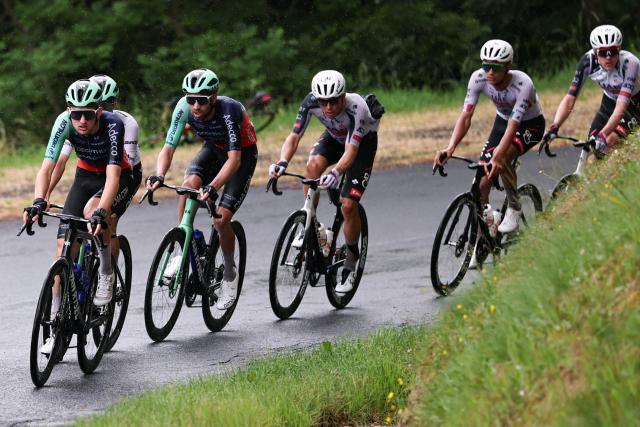Decathlon CMA CGM Team's French rider Paul Seixas (L) cycles with the pack of riders (peloton) during the 2nd stage of the Tour Auvergne-Rhone-Alpes cycling race (formerly known as the Criterium du Dauphine), 234,3km between Saint-Martin-Le-Vinoux in the French Alps and Le Puy-en-Velay near the Massif Central, on June 8, 2026. (Photo by Anne-Christine POUJOULAT / AFP)