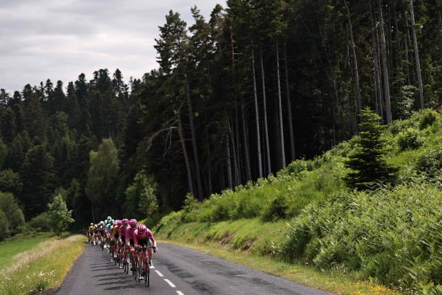 EF Education - EasyPost's team riders lead the pack of riders (peloton) during the 2nd stage of the Tour Auvergne-Rhone-Alpes cycling race (formerly known as the Criterium du Dauphine), 234,3km between Saint-Martin-Le-Vinoux in the French Alps and Le Puy-en-Velay near the Massif Central, on June 8, 2026. (Photo by Anne-Christine POUJOULAT / AFP)