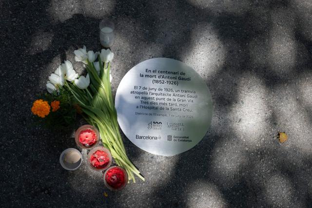 This picture taken on June 8, 2026 in Barcelona shows a commemorative plaque placed Gran Via Avenue at the spot where Sagrada Familia architect Antonio Gaudi was struck by a tram on June 7, 1926, leading to his death three days later in the hospital. Pope Leo XIV visits Spain from June 6-12, with stops in Madrid, Barcelona and the Canary Islands. In Barcelona, the pontiff is expected to visit the Sagrada Familia, where he will inaugurate its tallest tower, the Tower of Jesus Christ, during a ceremony marking the 100th centenary of the death of Gaudi, who designed the landmark. (Photo by Josep LAGO / AFP)