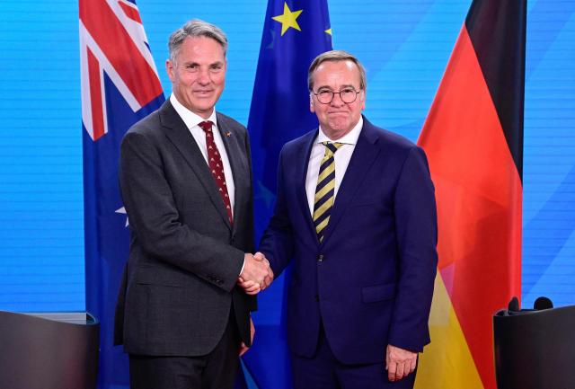 Australian Deputy Prime Minister and Defence Minister Richard Marles (L) and German Defence Minister Boris Pistorius shake hands at the end of a press conference at the Foreign Ministry in Berlin on June 8, 2026. (Photo by John MACDOUGALL / AFP)