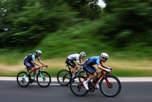 Bahrain Victorious's Belgian rider Vlad Van Mechelen (L), Movistar Team's Spanish rider Raul Garcia Pierna (C), Groupama-FDJ United's French rider Clément Braz Afonso (R) cycle during the 2nd stage of the Tour Auvergne-Rhone-Alpes cycling race (formerly known as the Criterium du Dauphine), 234,3km between Saint-Martin-Le-Vinoux in the French Alps and Le Puy-en-Velay near the Massif Central, on June 8, 2026. (Photo by Anne-Christine POUJOULAT / AFP)