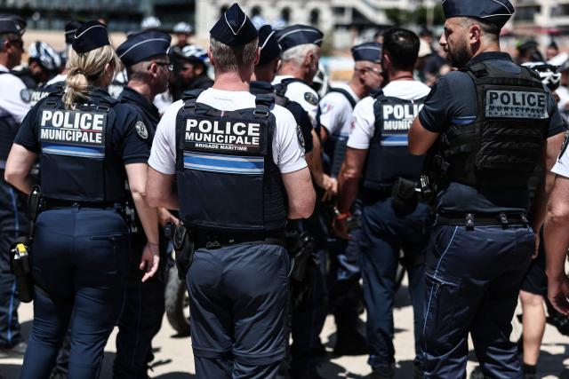 Police officers gather along the promenade in Catalans beach during a media briefing on security measures implemented on Marseille’s beaches, in southeastern France, on June 8, 2026. (Photo by Thibaud MORITZ / AFP)