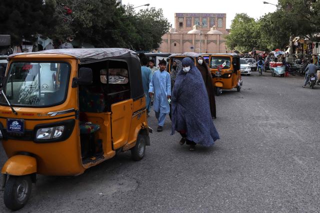 Afghan women wearing chador walk along the street near the Grand Mosque in Herat on June 8, 2026. Afghan residents in the western city of Herat have told AFP of witnessing multiple women detained by the Taliban government's morality police, in a crackdown over clothing which has drawn criticism from the United Nations. In Herat, residents witnessed women being detained on June 6 for not wearing the body-cloaking chador or burqa. They spoke to AFP on condition of anonymity for security reasons. (Photo by Mohsen KARIMI / AFP)