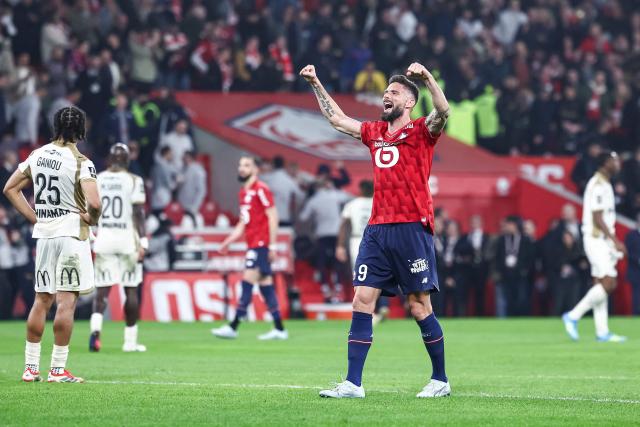 (FILES) Lille's French forward #09 Olivier Giroud (R) celebrates his team's victory at the end of the French L1 football match between Lille LOSC and RC Lens at the Stade Pierre-Mauroy in Villeneuve-d'Ascq, northern France on April 4, 2026. Olivier Giroud, the all-time leading goalscorer for Les Bleus, aged 39, has extended his contract with Lille by one year, the northern club announced on June 8, 2026. Having enjoyed a rather successful return to France last summer (11 goals in 44 matches across all competitions), the centre-forward has decided to postpone his retirement ahead of a season in which Lille will compete in the Champions League. (Photo by Sameer Al-DOUMY / AFP)