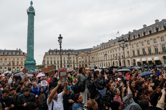 People gather at Palce Vendome outside the French Justice Ministry in Paris on June 8, 2026, at the call of the Mouv'Enfants collective and other organisations, to demand a law against violence on minors, following the death of Lyhanna, an 11-year-old girl found dead on June 4 after being reported missing on May 29 in southwestern France, on June 8, 2026. (Photo by GEOFFROY VAN DER HASSELT / AFP)