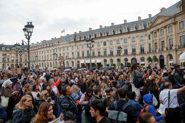 People gather for an unauthorised demonstration at Place Vendome outside the French Justice Ministry in Paris on June 8, 2026, at the call of the Mouv'Enfants collective and other organisations, to demand a law against violence on minors, following the death of Lyhanna, an 11-year-old girl found dead on June 4 after being reported missing on May 29 in southwestern France, on June 8, 2026. (Photo by GEOFFROY VAN DER HASSELT / AFP)