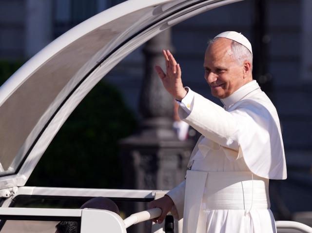 Pope Leo XIV waves as he leaves the Almudena Cathedral after leading prayer and devotion to Our Lady of Almudena in Madrid on June 8, 2026. Pope Leo XIV is visiting Spain June 6-12 with stops in Madrid, Barcelona, and the Canary Islands, where he will meet with migrants and organisations dedicated to helping them. (Photo by Cesar MANSO / AFP)