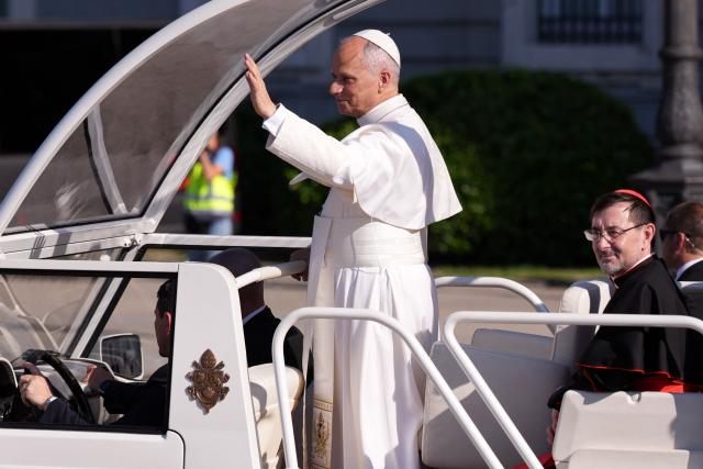 Pope Leo XIV waves as he leaves the Almudena Cathedral after leading prayer and devotion to Our Lady of Almudena in Madrid on June 8, 2026. Pope Leo XIV is visiting Spain June 6-12 with stops in Madrid, Barcelona, and the Canary Islands, where he will meet with migrants and organisations dedicated to helping them. (Photo by Cesar MANSO / AFP)
