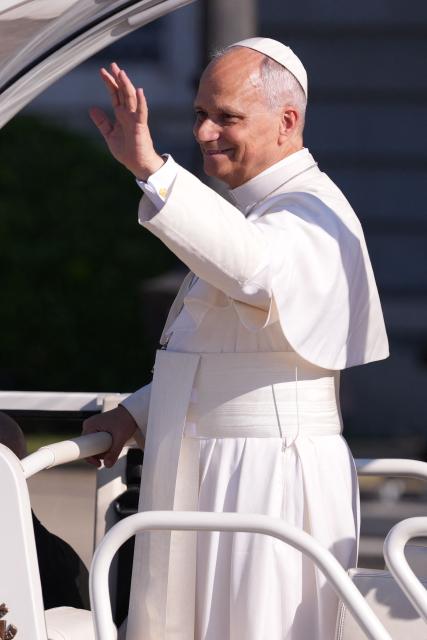 Pope Leo XIV waves to people from the popemobile as he leaves the Almudena Cathedral after leading prayer and devotion to Our Lady of Almudena in Madrid on June 8, 2026. Pope Leo XIV is visiting Spain June 6-12 with stops in Madrid, Barcelona, and the Canary Islands, where he will meet with migrants and organisations dedicated to helping them. (Photo by Cesar MANSO / AFP)