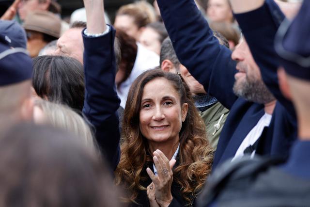 Coline Berry-Rojtman, daughter of French actor Richard Berry, takes part in an unauthorised demonstration near Place Vendome outside the French Justice Ministry in Paris on June 8, 2026, at the call of the Mouv'Enfants collective and other organisations, to demand a law against violence on minors, following the death of Lyhanna, an 11-year-old girl found dead on June 4 after being reported missing on May 29 in southwestern France, on June 8, 2026. (Photo by GEOFFROY VAN DER HASSELT / AFP)