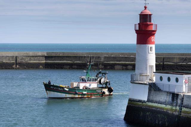 A fisherman's boat comes ashore at the port of Guilvinec, western France on June 8, 2026. (Photo by Fred TANNEAU / AFP)