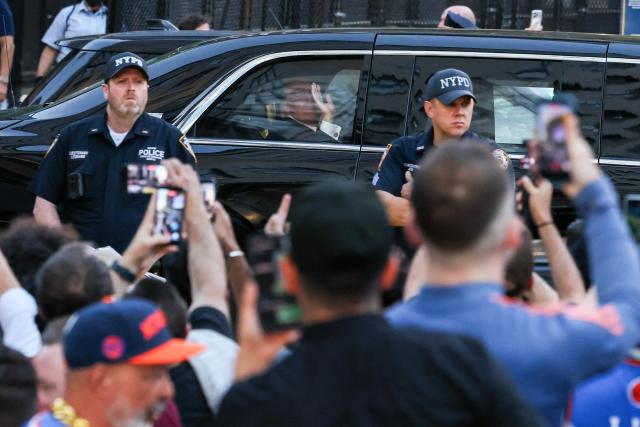 US President Donald Trump waves to fans as he arrives at Madison Square Garden ahead of NBA Finals game 3 between the New York Knicks and the San Antonio Spurs in New York, on June 8, 2026. (Photo by CHARLY TRIBALLEAU / AFP)