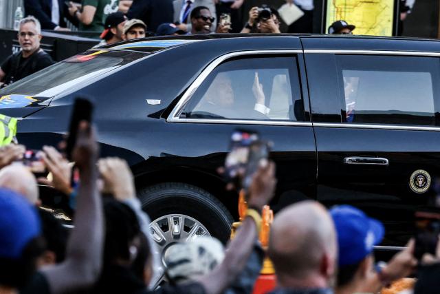 US President Donald Trump waves to fans as he arrives at Madison Square Garden ahead of NBA Finals game 3 between the New York Knicks and the San Antonio Spurs in New York, on June 8, 2026. (Photo by CHARLY TRIBALLEAU / AFP)