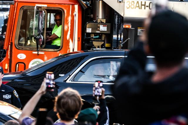 People take photos of US President Donald Trump as he arrives at Madison Square Garden for NBA Finals game 3 between the New York Knicks and the San Antonio Spurs in New York, on June 8, 2026. (Photo by CHARLY TRIBALLEAU / AFP)