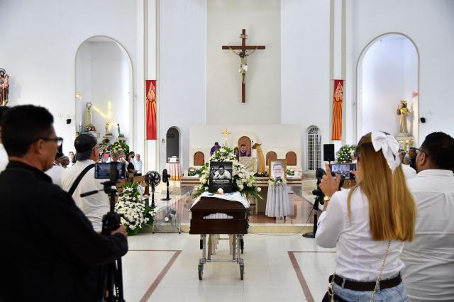 The coffin of slain journalist Cristian Herrera is seen during a funeral ceremony in Cucuta, Colombia, on June 8, 2026. Herrera was killed on June 6, 2026, on the Colombia-Venezuela border, following the death of another journalist attacked by guerrillas nearly a month ago according to the Ombudsman's Office. A hitman riding a motorcycle shot the journalist, who died while being taken to a hospital, according to local media. (Photo by Schneyder Mendoza / AFP)