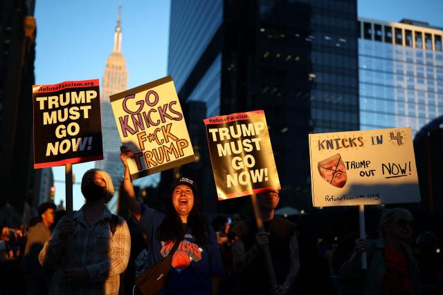 New York Knicks fans protest US President Donald Trump's presence outside Madison Square Garden during Game three of the NBA Finals between the San Antonio Spurs and the New York Knicks in New York, on June 8, 2026. (Photo by CHARLY TRIBALLEAU / AFP)