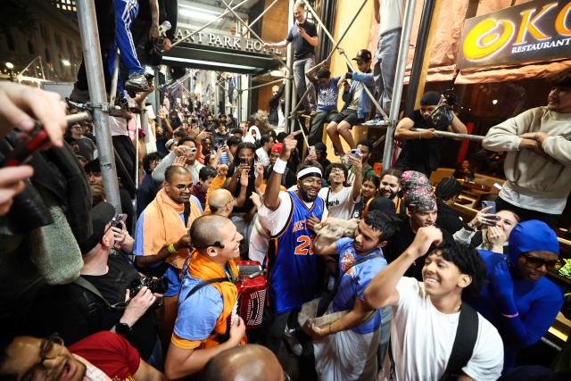 New York Knicks fans react during game three of the NBA Finals between the San Antonio Spurs and the New York Knicks near Bryant Park, in New York, on June 8, 2026. (Photo by CHARLY TRIBALLEAU / AFP)