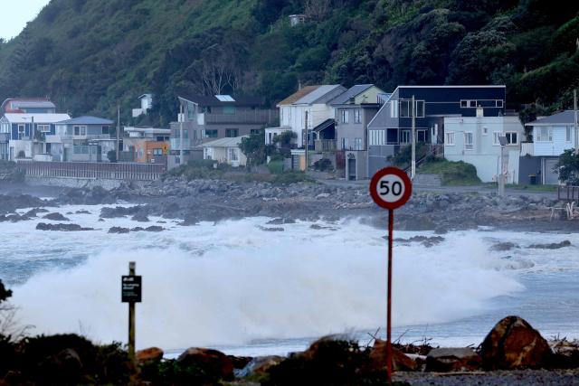 Stormy seas pound the coastline in the Wellington suburb of Owhiro Bay on June 9, 2026. Hundreds of people were forced to evacuate their seaside homes on June 9 in New Zealand's capital as 11-metre high waves lashed the city's south coast. (Photo by Ben STRANG / AFP)