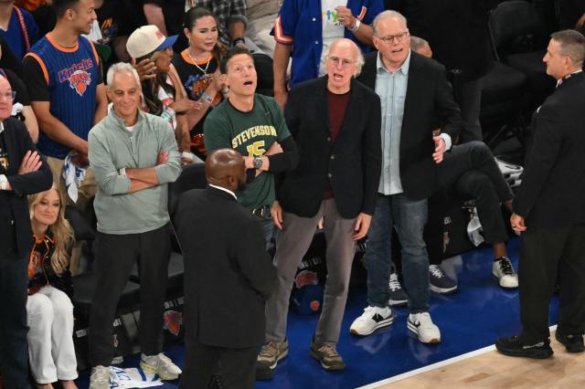 Former White House chief of staff Rahm Emanuel (L) and US actor Larry David (2R) watch Game Three of the NBA Finals between the San Antonio Spurs and the New York Knicks at Madison Square Garden in New York on June 8, 2026. (Photo by SAUL LOEB / AFP)