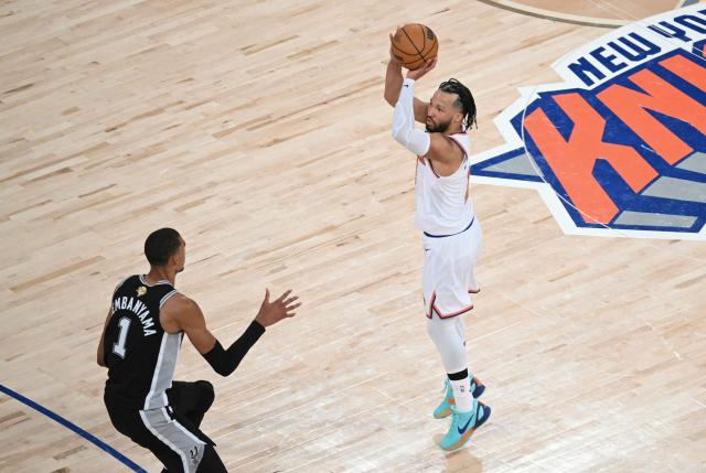 San Antonio Spurs' French forward-center #01 Victor Wembanyama looks on as Knicks guard #11 Jalen Brunson takes a shot on basket during Game Three of the NBA Finals between the San Antonio Spurs and the New York Knicks at Madison Square Garden in New York on June 8, 2026. (Photo by SAUL LOEB / AFP)