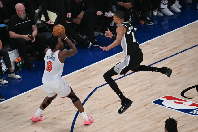 San Antonio Spurs' French forward-center #01 Victor Wembanyama jumps as Nicks' British-US player #08 OG Anunoby prepares to throw during Game Three of the NBA Finals between the San Antonio Spurs and the New York Knicks at Madison Square Garden in New York on June 8, 2026. (Photo by SAUL LOEB / AFP)