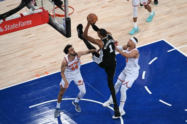 San Antonio Spurs' French forward-center #01 Victor Wembanyama shoots the ball while being defended by Knicks guard #44 Landry Shamet and Knick guard #03 Josh Hart during Game Three of the NBA Finals between the San Antonio Spurs and the New York Knicks at Madison Square Garden in New York on June 8, 2026. (Photo by SAUL LOEB / AFP)