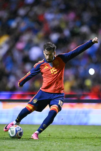 Spain's midfielder #15 Alex Baena shoots the ball during the international friendly football match between Peru and Spain at Cuauhtemoc Stadium in Puebla, Mexico, on June 8, 2026. (Photo by CARL DE SOUZA / AFP)