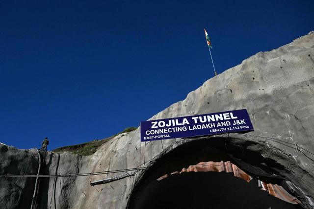 An Indian paramilitary personnel stands guard at the Zojila tunnel, India's longest road tunnel project connecting Jammu and Kashmir state with the Ladakh region on June 9, 2026. (Photo by TAUSEEF MUSTAFA / AFP)